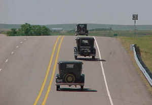 Three Model A Fords heading south in Texas on Highway 83